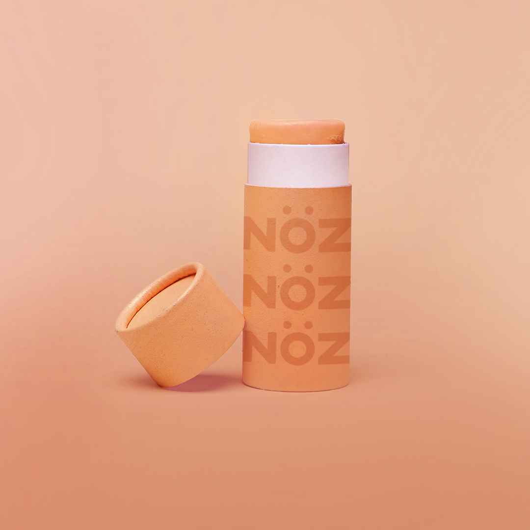 Front view of NÖZ orange sunscreen open package