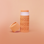 Load image into Gallery viewer, Front view of NÖZ orange sunscreen open package
