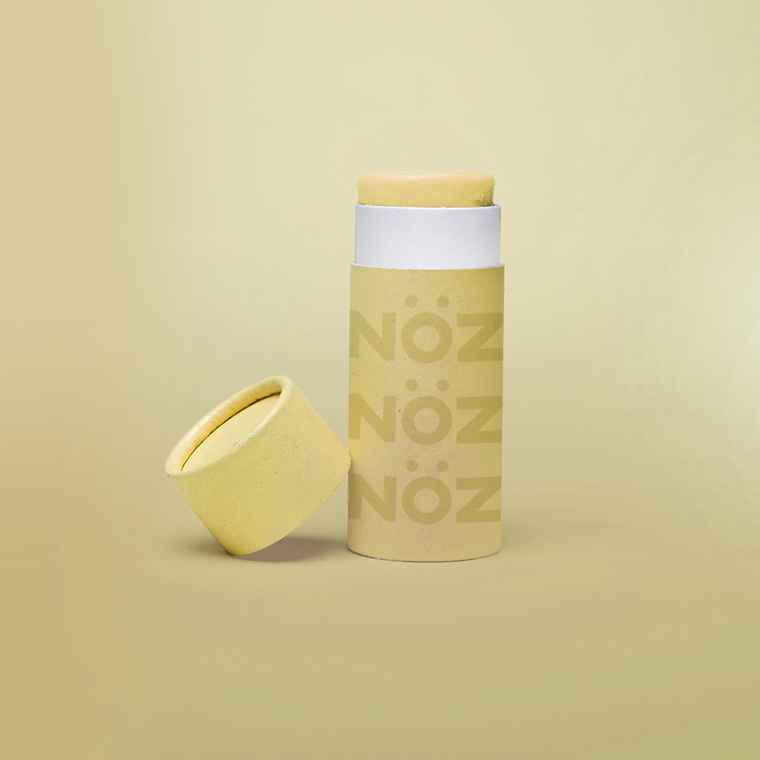 Front view of NÖZ yellow sunscreen open package